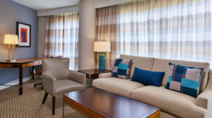 Junior suite with couch and living chairs