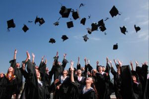 Graduates tossing their caps